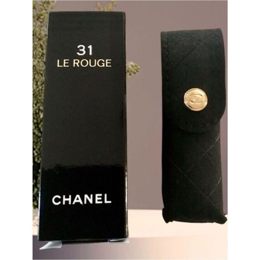 Chanel 31 Le Rouge lipstick case, a black quilted velvet pouch.